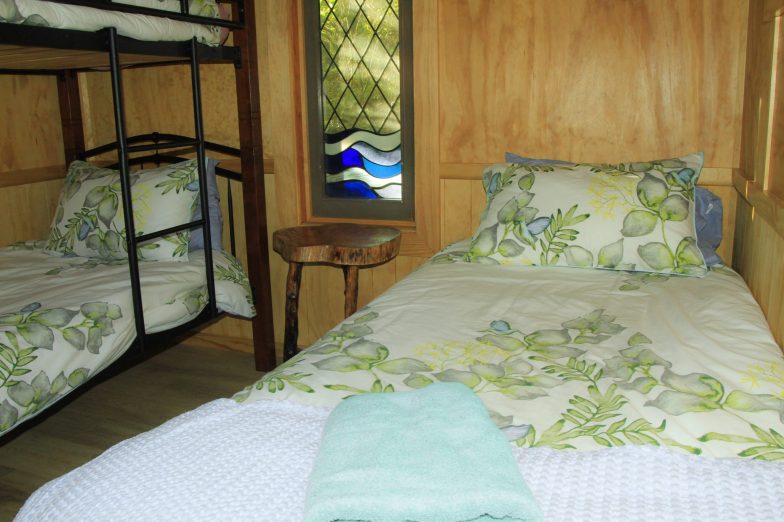 Quaint bedroom with bunk beds and single bed