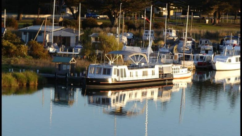 Picturesque barge reflecting on the water