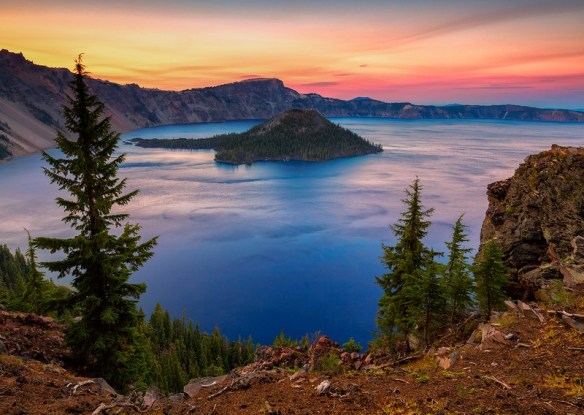 panoramic shot of crater lake as sun is setting