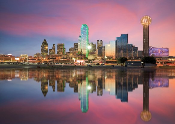 Dallas skyline reflected in Trinity river at sunset