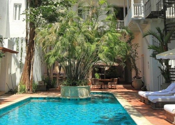 Square pool with greenery backdrop