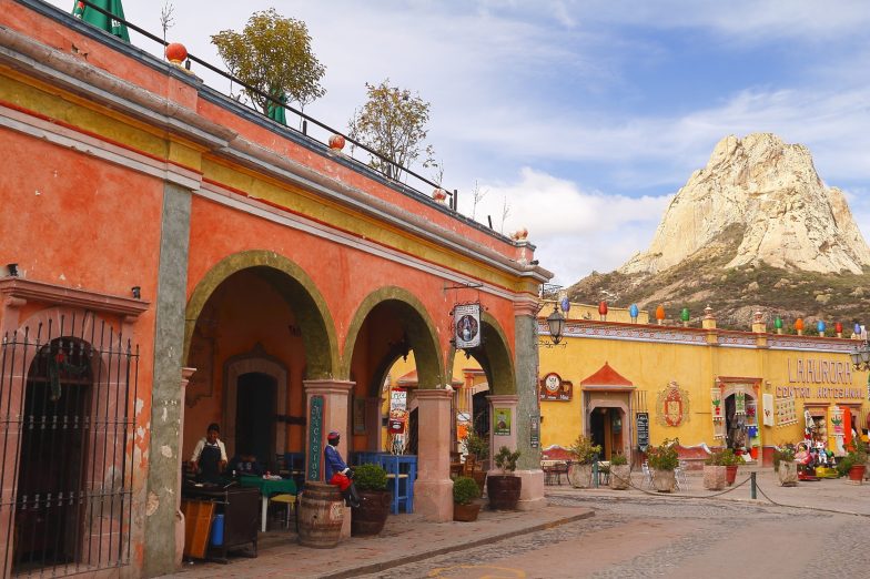 Houses and monolith in Peña de Bernal, Queretaro, Mexico