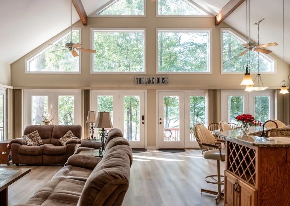 Large windows illuminate a spacious living room