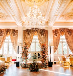 Banquet style room with chandeliers