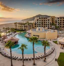 outdoor pool next to hotel and ocean