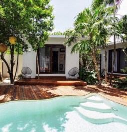 A pool and villa at tulum resort