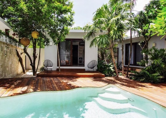 A pool and villa at tulum resort