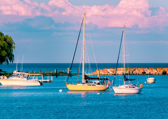 Sail boats docked at the marina at Mackinac Island during sunset